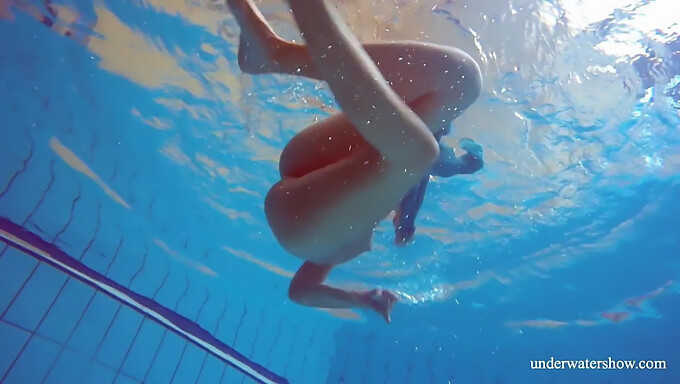 Brunette teen in pool without clothes