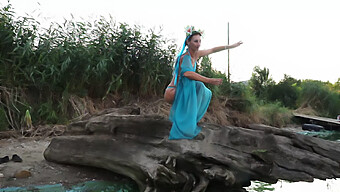 Arab Mature Woman Dances On The Beach At Sunset